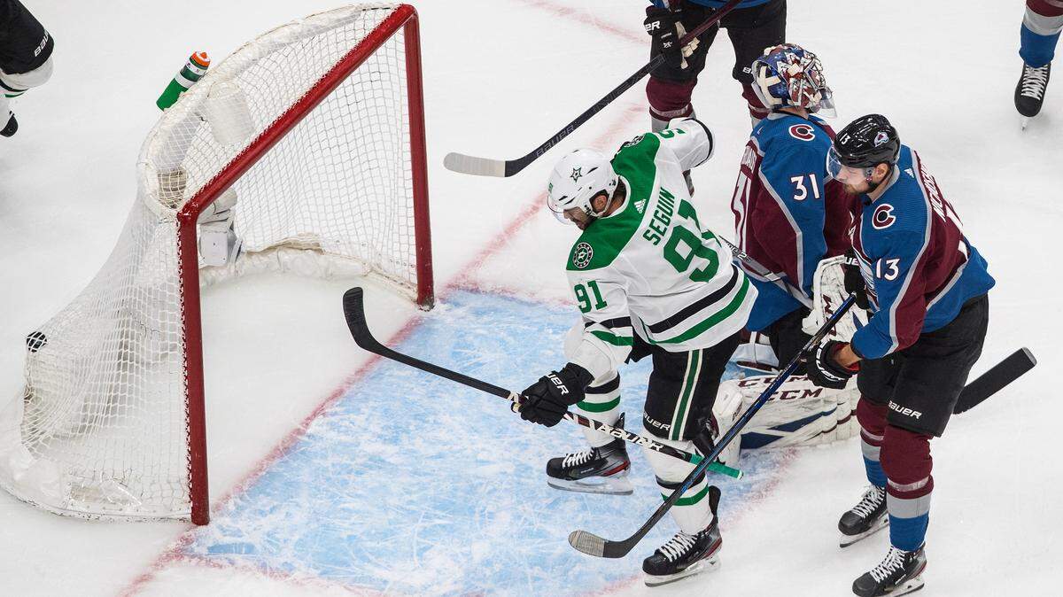 Colorado Avalanche goalie Philipp Grubauer (31) is scored on by Dallas Stars’ Tyler Seguin (91) as Valeri Nichushkin (13) defends during the first period in Game 1 of an NHL hockey playoff second-round series, in Edmonton, Alberta, Saturday, Aug. 22, 2020. (Jason Franson/The Canadian Press via AP)