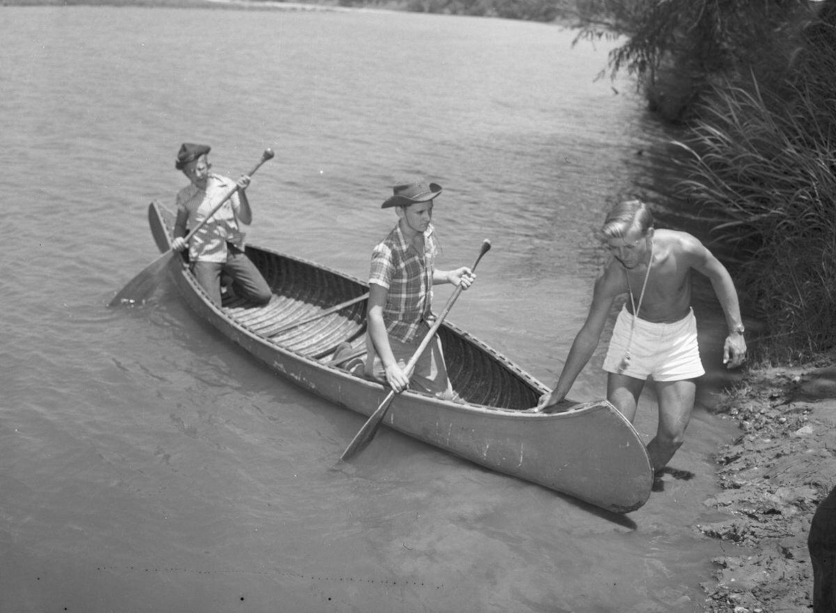 July 26, 1944: Charles Crabtree, right, waterfront director, instructs Danny Wier, left, son of Mrs. Mable McKinney Weir, and Bob Riedel (middle), son of Mr. and Mrs. A.F. Riedel, in canoeing.
