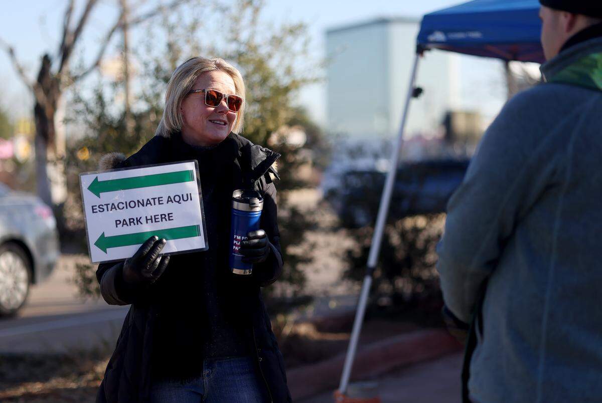 Lee Michaels, a retired corporate attorney, volunteers outside the Customs Enforcement field office in Dallas on Friday, Jan. 16, 2026. 