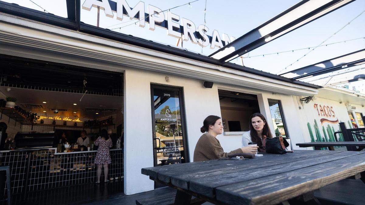 Meredith Thomas, left, and Mairin Hasson drink coffee outside at Ampersand Friday, Oct. 21, 2022, in Fort Worth. Ampersand topped the poll for Star-Telegram’s Reader’s Choice Best Coffee Shop.
