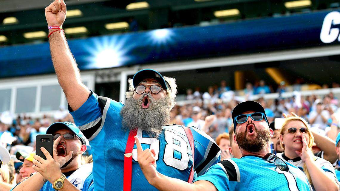 Panthers fans cheer as the team runs onto the field at Bank of America Stadium to face the Dallas Cowboys on Sunday.