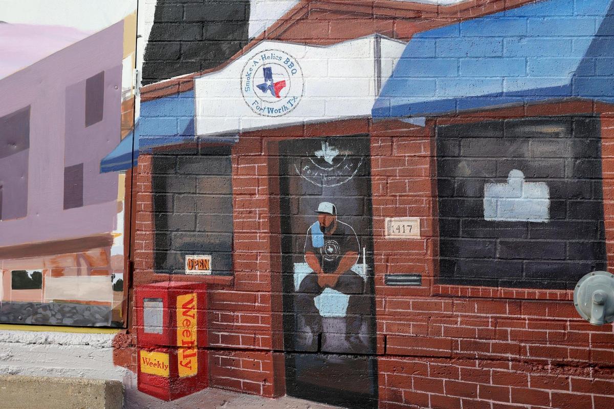 A mural, commissioned by CommUnity Frontline of Fort Worth and completed by Texas-based artist Armando Castelan features black businesses and entrepreneurs, including Fort Worth favorite Smoke-A-Holics BBQ.
