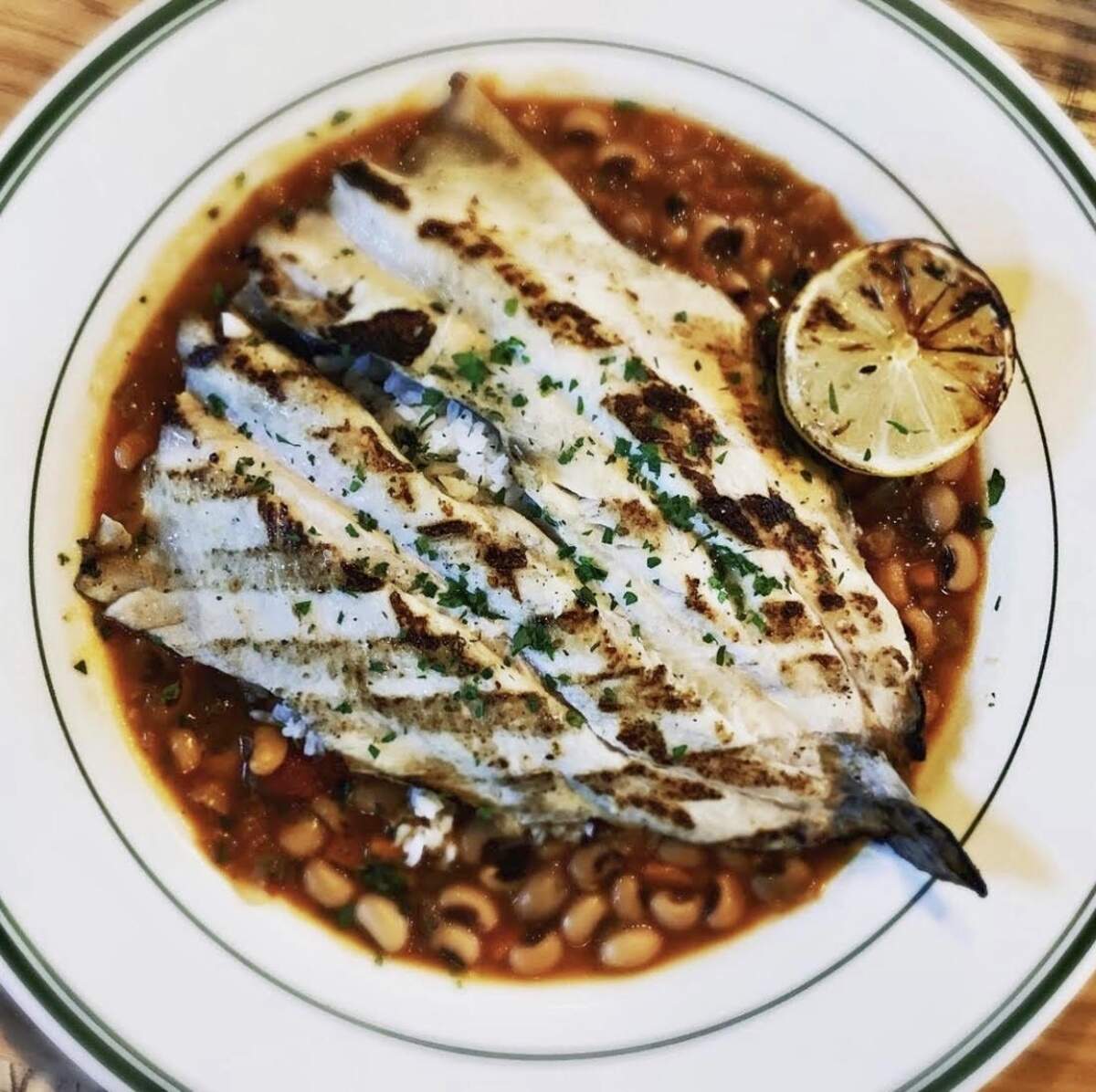 Grilled trout with hoppin’ John at Provender Hall.