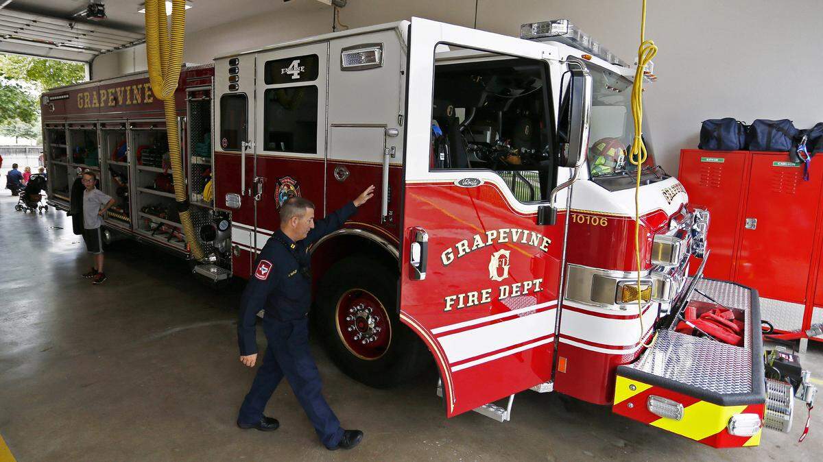 In this file photo from Aug. 13, 2016, Grapevine fire Capt. Jamey Shipler walks to the cab of a new engine.