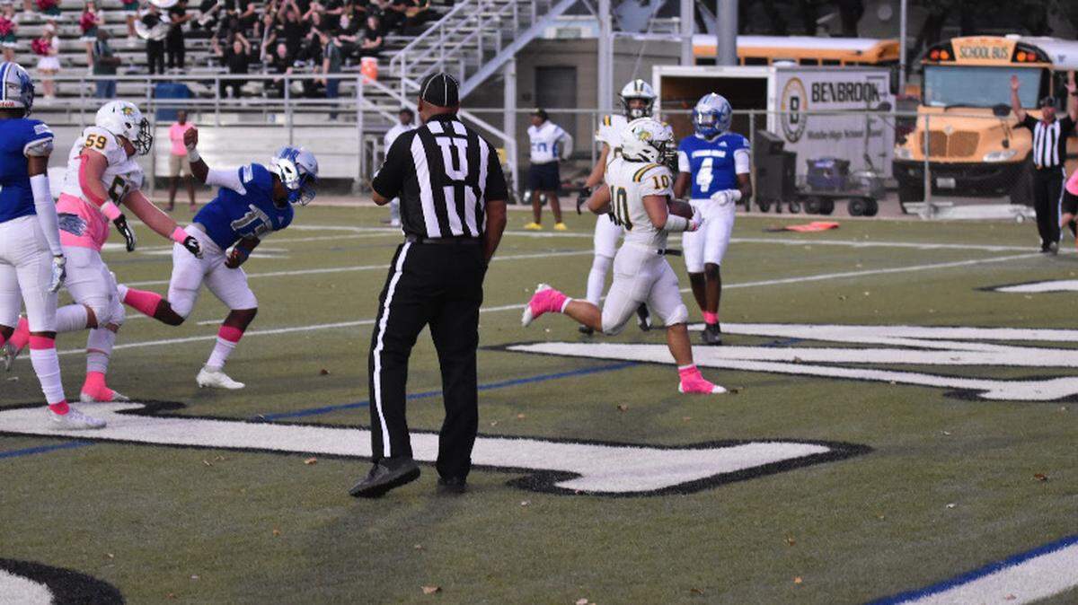 Benbrook’s Harry Gonzales (10) leads the Bobcats to their first touchdown of the night during a high school football game against Eastern Hills at Handley Field in Fort Worth, Texas, Thursday Oct. 7, 2021 Benbrook won 20-19. (Jaylyn Ferguson/special to the Star-Telegram)