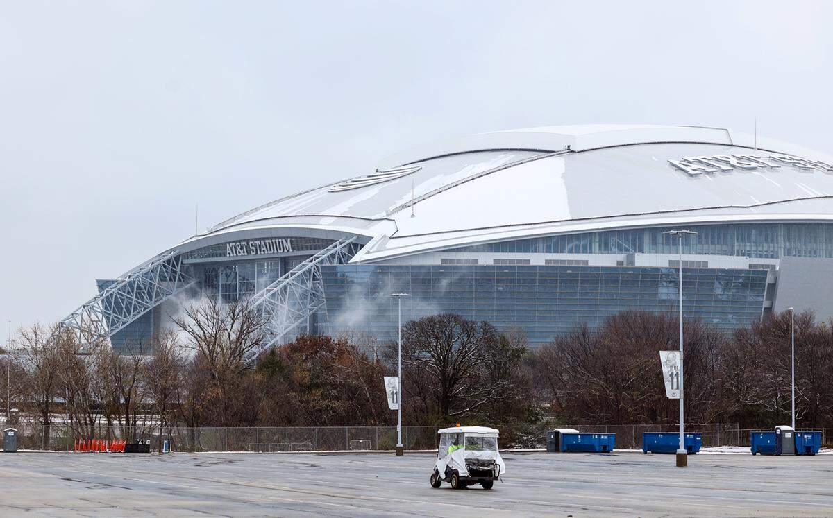 Small amounts of snow remain on the roof of AT&T Stadium on Friday morning, Jan. 10, 2025, in Arlington the day after a winter storm blew through the region. The Cotton Bowl will kick off at 6:30 p.m.