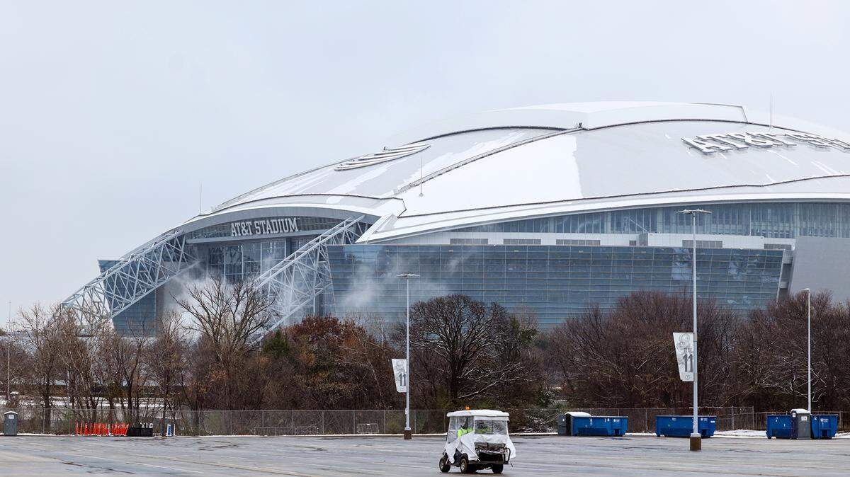 Small amounts of snow remain on the roof of AT&T Stadium on Friday morning, Jan. 10, in Arlington the day after a winter storm blew through the region. The Cotton Bowl will kick off at 6:30 p.m.