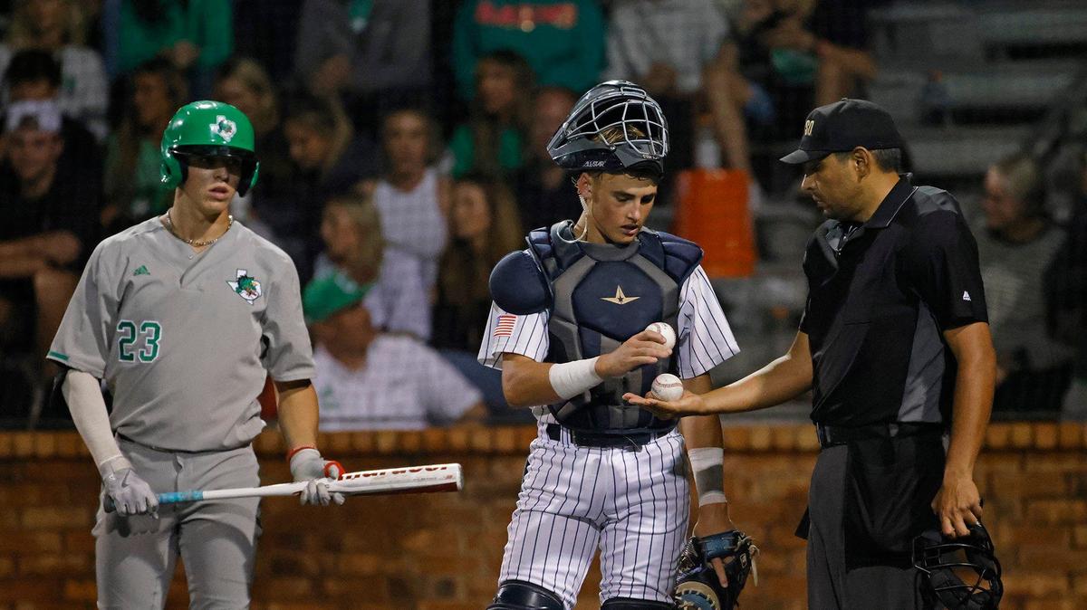 Keller catcher Jake Scheiden checks balls with the home plate umpire as Southlake infielder Evan Robson waits to bat during a UIL District 6A Region 1 Quarterfinals baseball game at L.D. Bell in Hurst, Texas, Thursday, May 16, 2024.