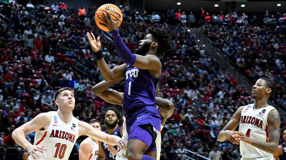 TCU guard Mike Miles (1) puts up a shot above Arizona forward Azuolas Tubelis (10) during their second-round NCAA tournament game on March 20. Less than two weeks after declaring for the NBA draft, Miles announced that he’s returning to the Horned Frogs next season.