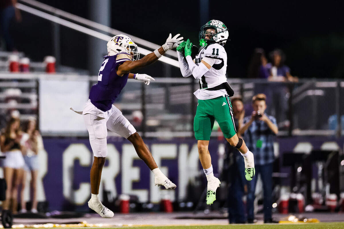 Southlake Carroll defensive back Taevin Kunz (11) catches a pass for an interception that would result in a touchdown in a district matchup against Keller Timber Creek on Thursday, September 25, 2025 at Keller ISD Stadium in Keller, Texas.