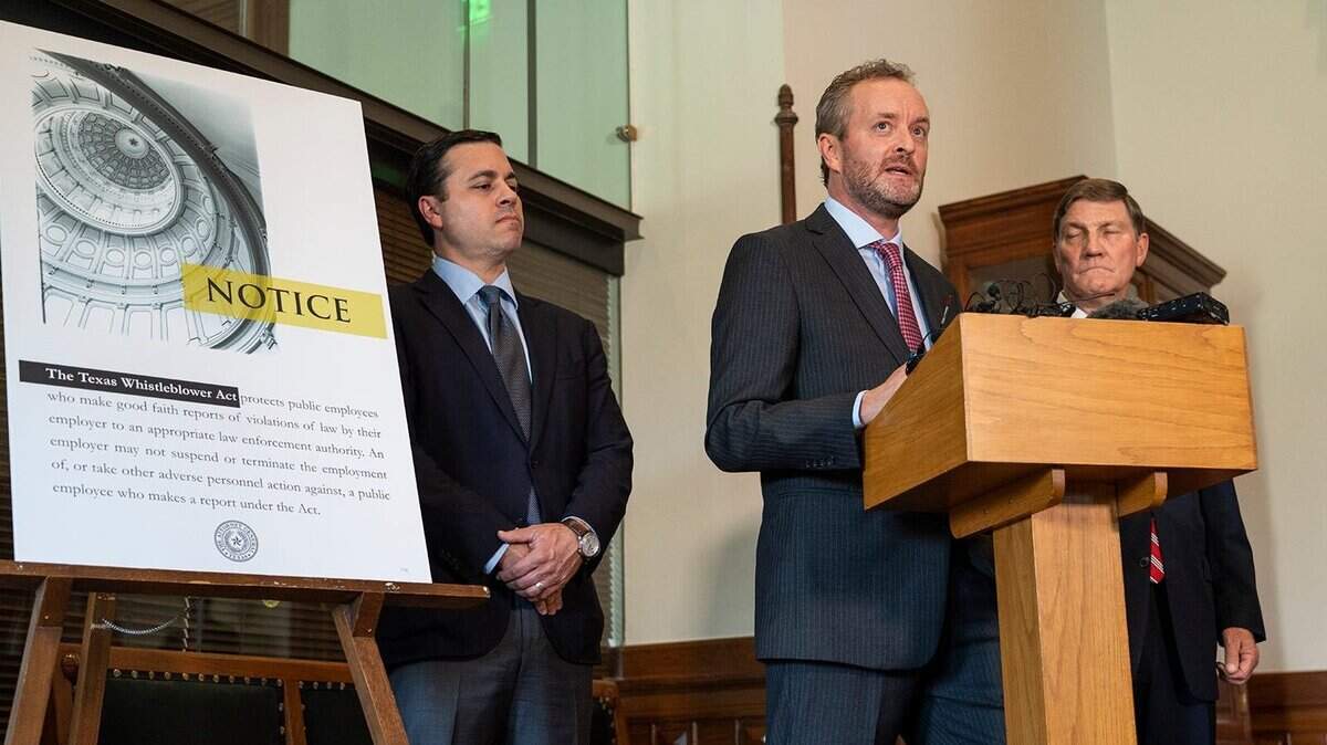 From left, Ryan Vassar, Blake Brickman and Mark Penley, all former senior-level employees of the Office of the Attorney General, speak to members of the press during a news conference at on Monday.