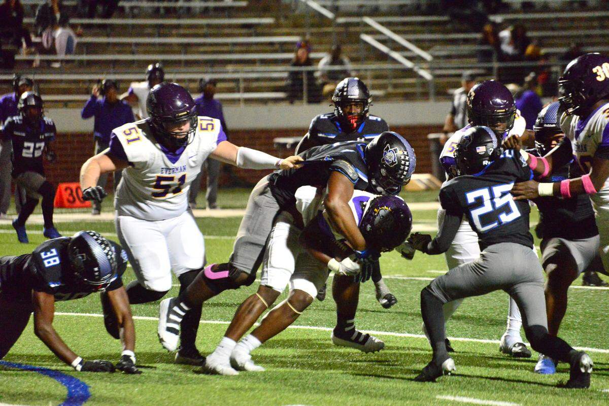 Mansfield Summit defensive lineman Travis Buhake smothers an Everman running back on Thursday, Oct. 31, 2024 at Newsom Stadium in Mansfield, Texas.