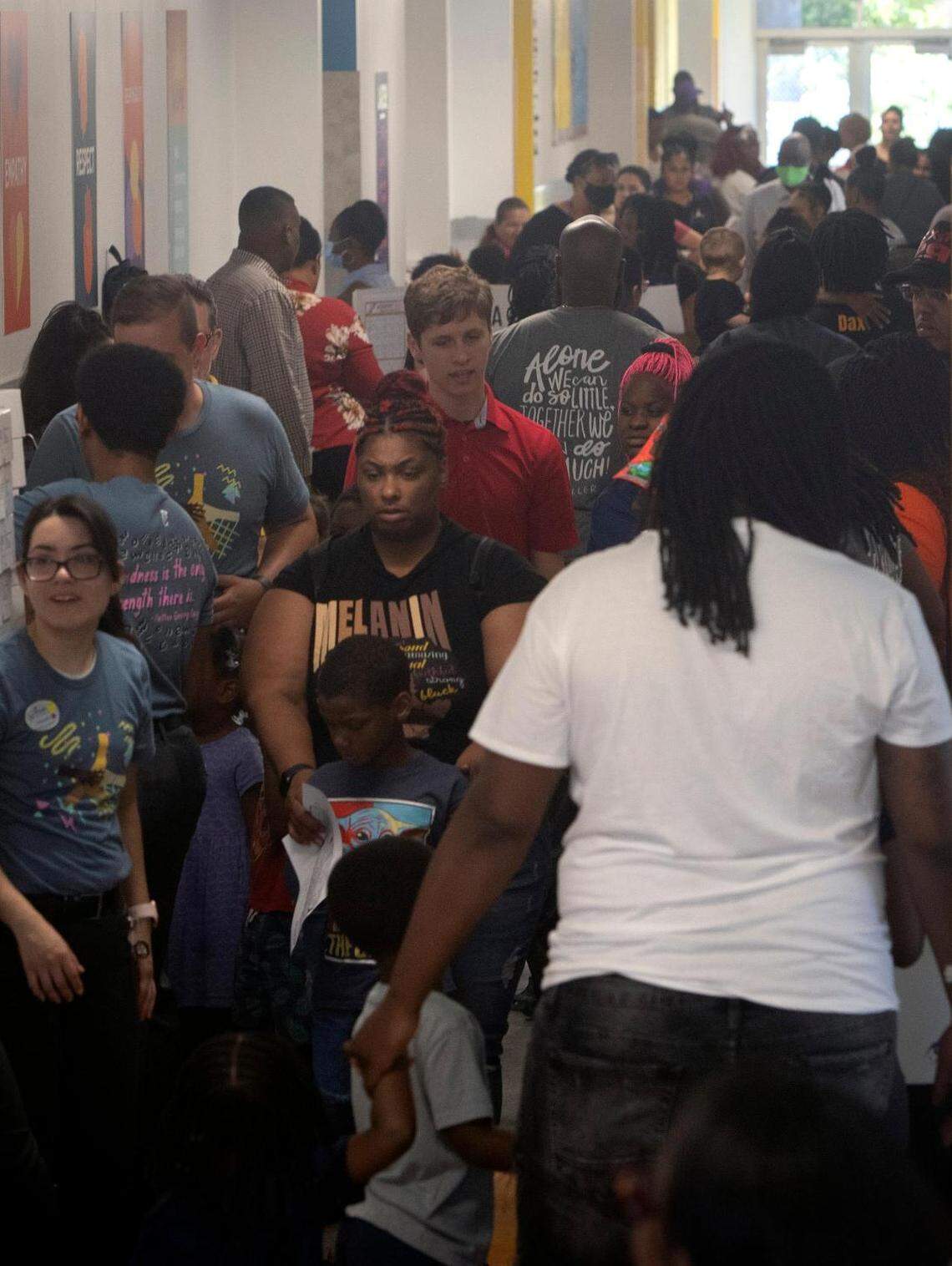 Parents, teachers and students fill the hallways at Rocketship Dennis Dunkins Elementary in Fort Worth, Texas, on Saturday, Aug. 6, 2022. The new charter school opened its doors to parents and students the weekend before school began Monday.