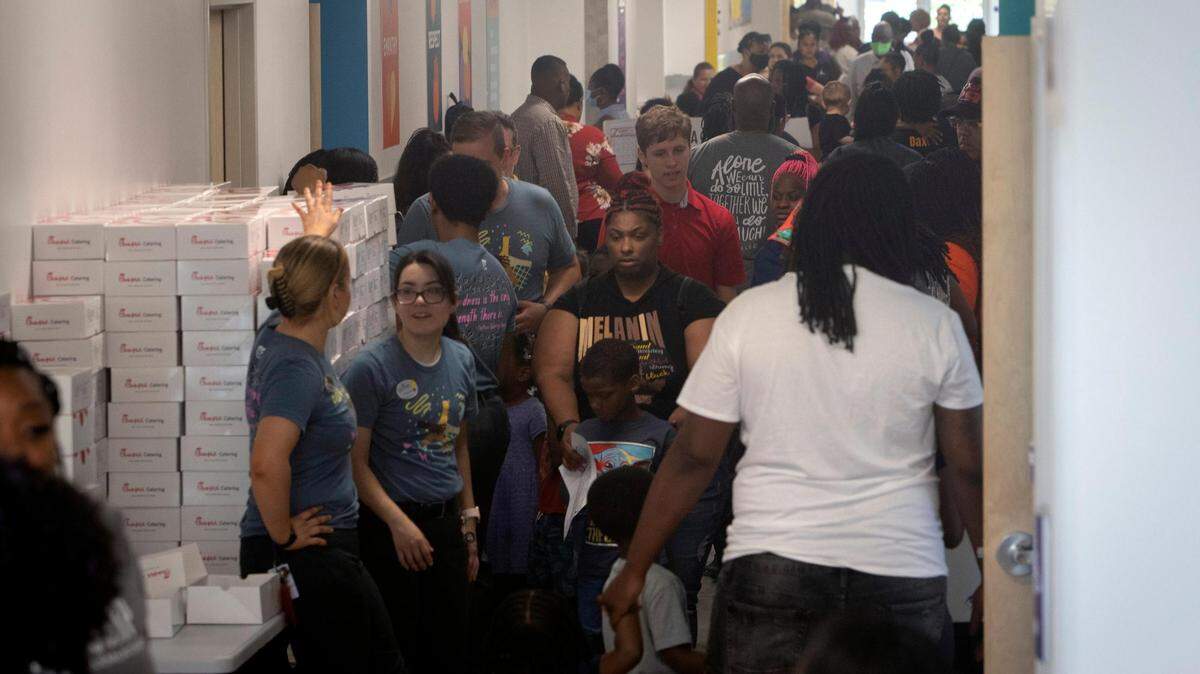 Parents, teachers and students fill the hallways at Rocketship Dennis Dunkins Elementary in Fort Worth on Aug. 6, 2022. The new charter school opened its doors to parents and students the weekend before school began.