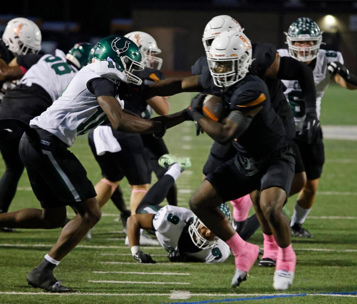 Bowie running back Darrion Bowers (6) works the middle during a District 8-6A football game at C.H. Wilemon Field in Arlington, Texas, Friday, Oct. 18, 2024.
