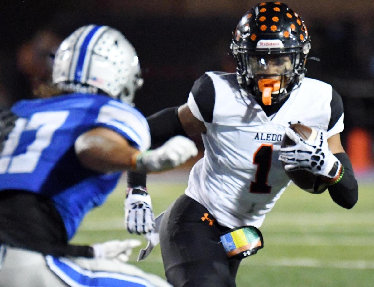 Centennial’s Aiden Hicks, left tries to stop Aledo’s Hawk Patrick Daniels as he scrambles out of the backfield in the seocnd quarter of Friday’s October 14, 2022 District 3-5A Division 1 football game at Burleson ISD Stadium in Burleson, Texas. Special/Bob Haynes