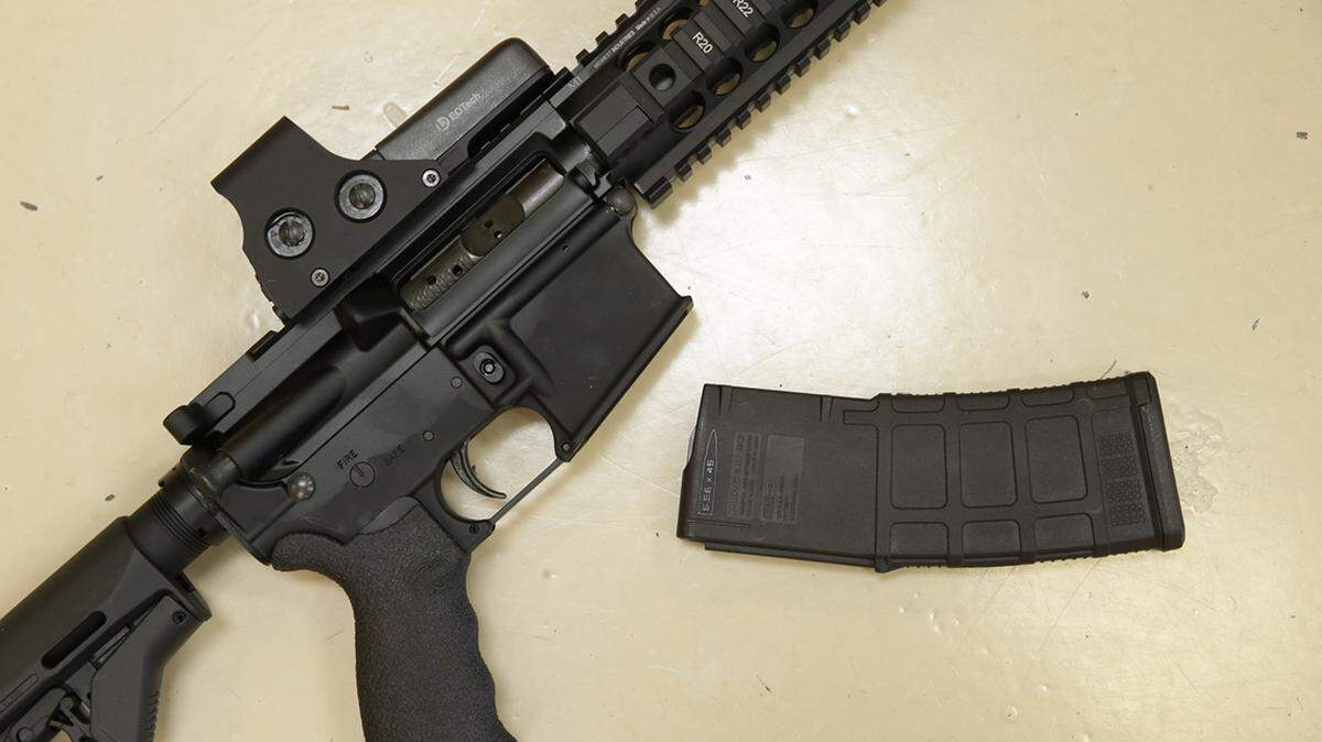 FILE - In this Oct. 3, 2013, file photo, a custom-made semi-automatic hunting rifle with a high-capacity detachable magazine is displayed at TDS Guns in Rocklin, California.