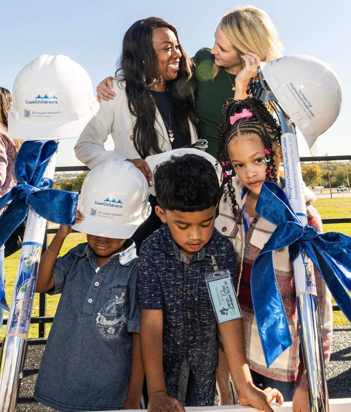 Western Hills Primary School Principal Andrea Johnson, left, embraces Fort Worth Mayor Mattie Parker along with Western Hills Pre-K students Marques Cook, 4, Darius Cotter, 4, and Peyton Arbell, 7, following the groundbreaking ceremony for the Las Vegas Trail Neighborhood Health Center in Fort Worth on Tuesday, Nov. 14, 2023.