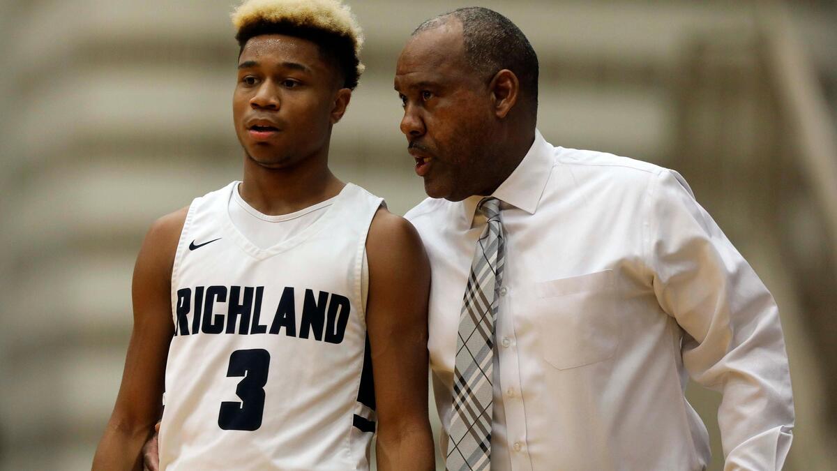 Richland head coach Richard A. Bacon talks to guard CJ Nelson (3) in the first quarter of the Lions Club Girls and Boys Holiday Basketball Tournament boys championship game at W. G. Thomas Coliseum in Haltom City, Texas, Saturday, Dec. 07, 2019. Richland led 21-12 after the first quarter. (Special to the Star-Telegram Bob Booth)