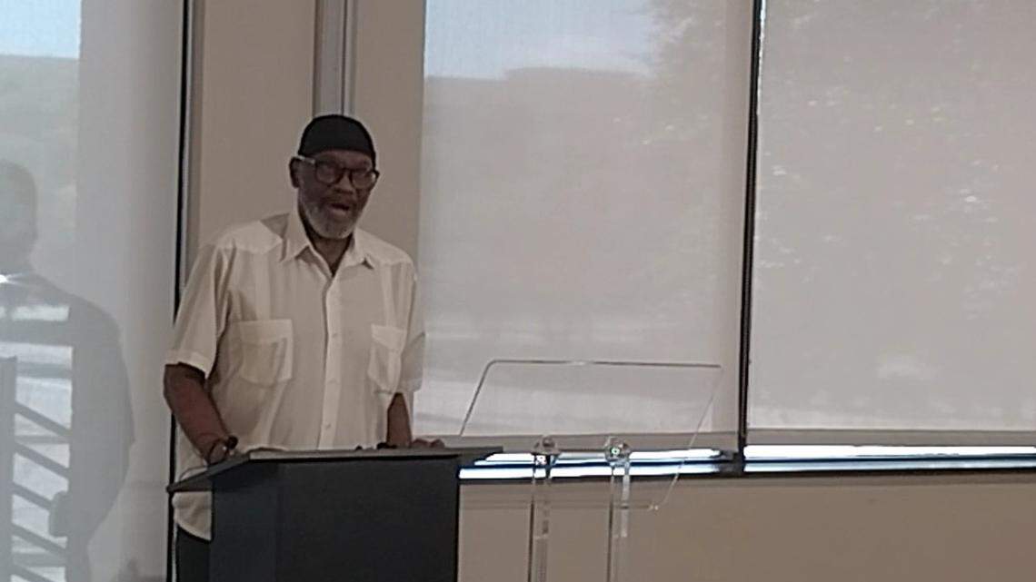 Mustafaa Carroll, a spokesperson for the Council on American-Islamic Relations, reads a statement at a news conference Saturday about an alleged hate crime committed against a Palestinian woman and her two children at a Euless swimming pool in May. A 42-year-old woman has been arrested and charged with attempted capital murder and injury to a child.