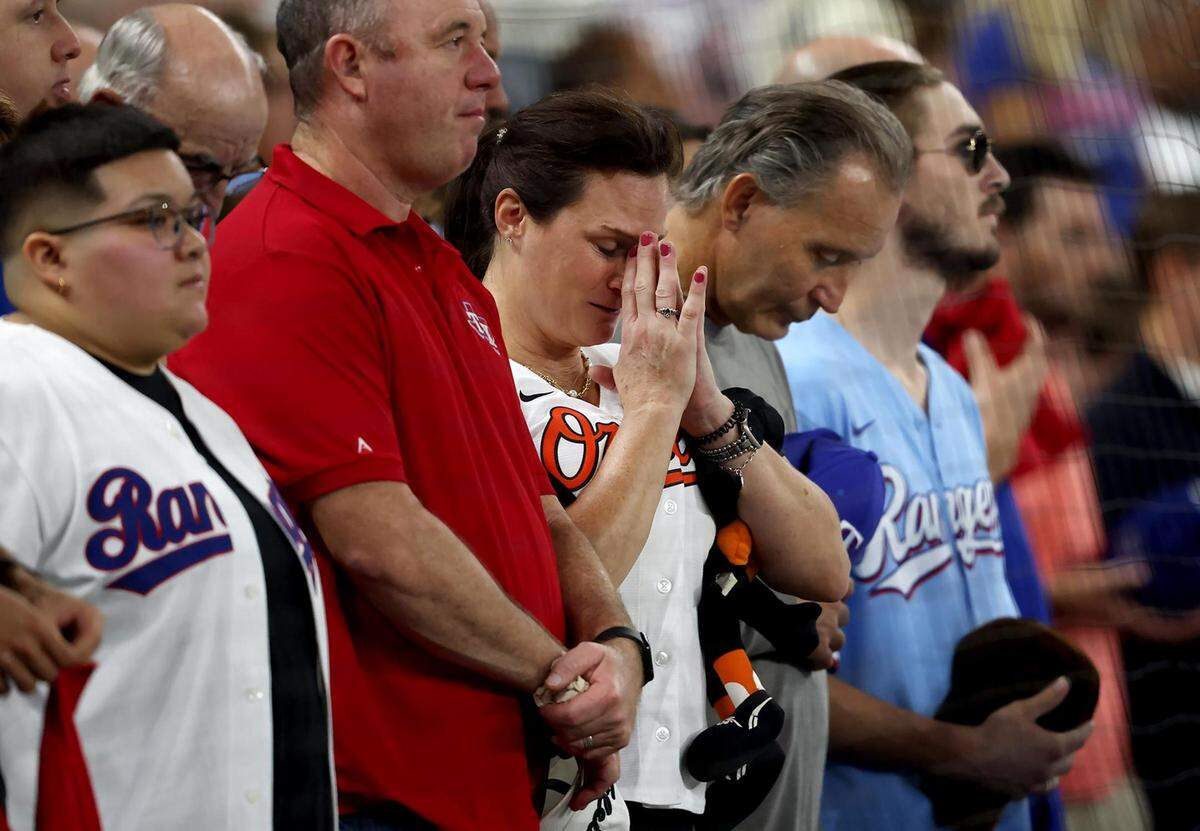 Texas Rangers and Baltimore Orioles fans bow their heads for a moment of silence for Israel prior to the start of Game 3 of the ALDS on Tuesday, October 10, 2023, at Globe Life Field in Arlington.