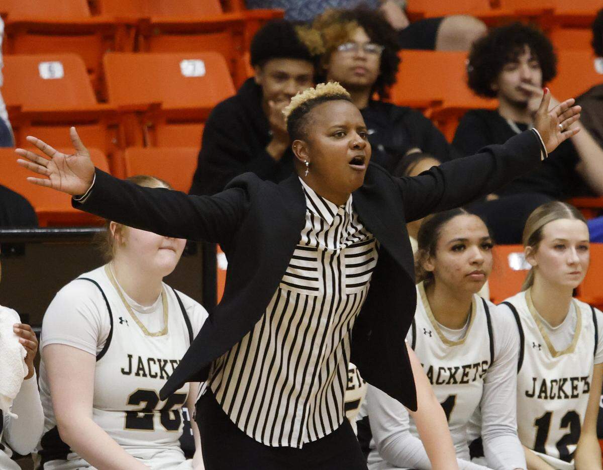 Cleburne head coach Tiffany Hill shouts out instructions against Arlington Heights on the defensive end during the first half of the UIL 5A D1 girls bi-district championship basketball game at Wilkerson Greines Activity Center in Fort Worth, Texas, Monday Feb. 16, 2026.