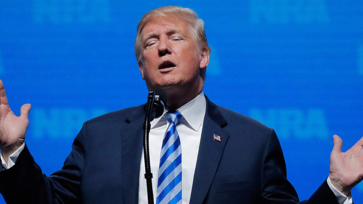 U.S. President Donald Trump gestures before he speaks at a National Rifle Association (NRA) convention in Dallas, Texas, U.S. May 4, 2018.