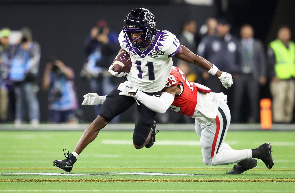 Georgia safety Chris Smith tackles TCU wide receiver Derius Davis during the first half of the 2023 College Football Playoff National Championship on Monday, January 9, 2023, at SoFi Stadium in Inglewood, Calif.