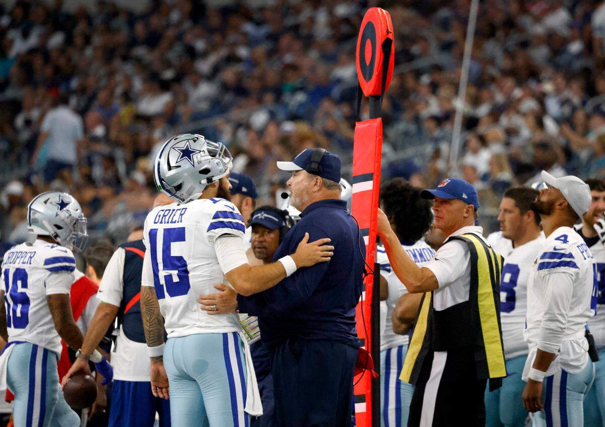 Dallas Cowboys head coach Mike McCarthy talks to quarterback Will Grier during the first preseason game against the Jacksonville Jaguars on Saturday. Dak Prescott didn’t take any snaps during the game.