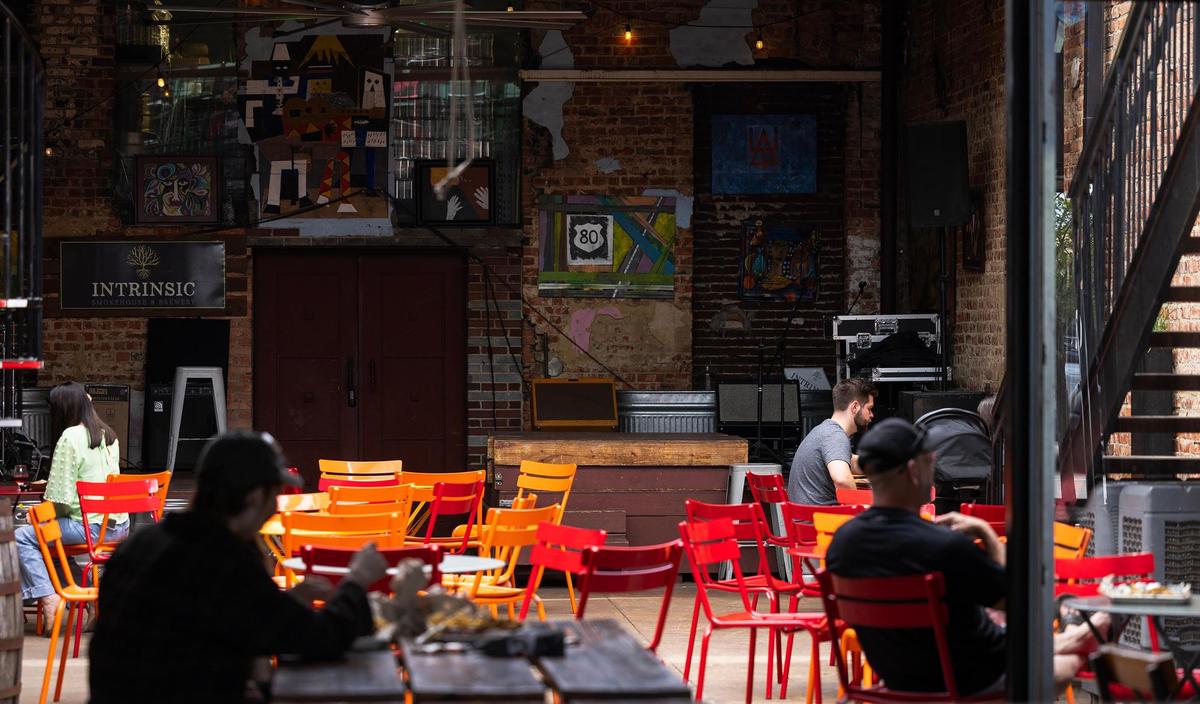 Guests enjoy lunch at Intrinsic Brewery in downtown Garland on Thursday, May 8, 2025. The brewery will be one of the local venues hosting live music during the city’s celebration on May 17 of the 50th anniversary of the release of Willie Nelson’s ‘Red Headed Stranger’ album.