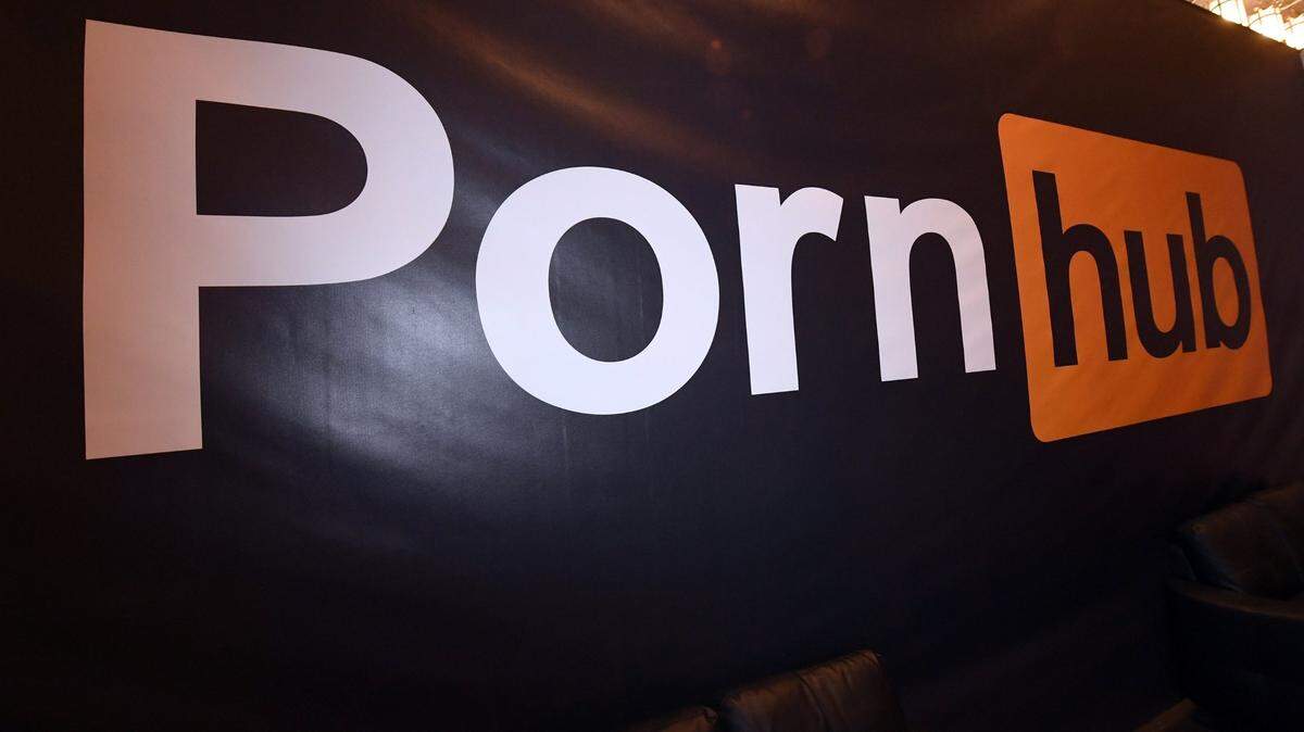 A Pornhub logo is displayed at the company’s booth at the AVN Adult Entertainment Expo at the Hard Rock Hotel & Casino on Jan. 24, 2018, in Las Vegas. (Ethan Miller/Getty Images/TNS)