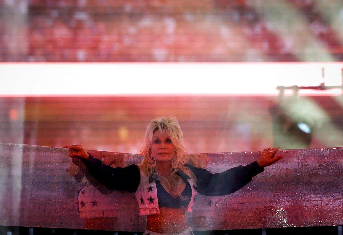 Dolly Parton performs during the Dallas Cowboys’ halftime show to kickoff the Red Kettle Campaign on Thursday, November 23, 2023, at AT&T Stadium in Arlington.