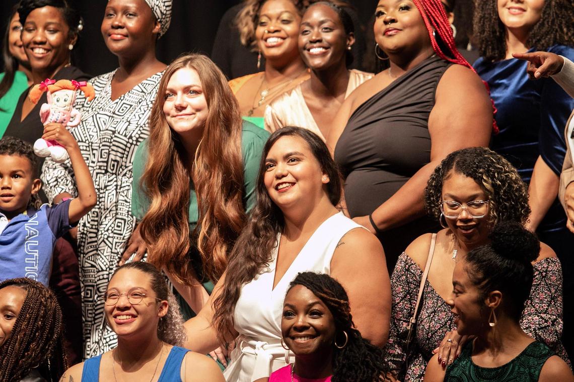 Sofia Pimienta (center white dress) poses for a class picture. Pimienta is graduating from the United Way Doula program on Saturday October 26, 2024.