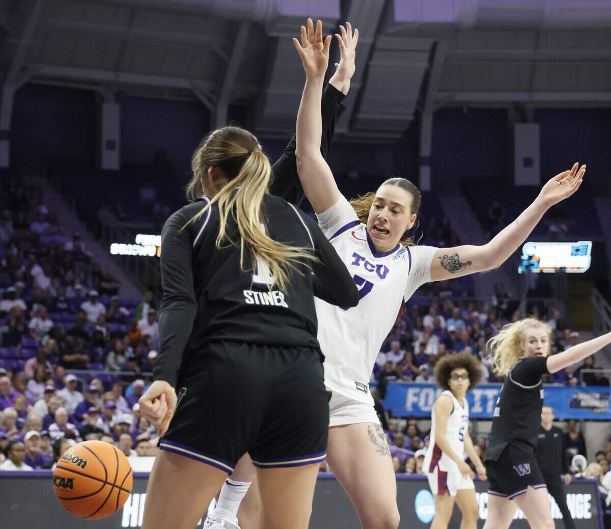 TCU forward Marta Suarez (7) looses the ball in front of Washington guard Hannah Stines (1) during the first half of a second round NCAA Division I Women's Basketball Championship game at Schollmeier Arena in Fort Worth, Texas, Sunday, March, 22, 2026.