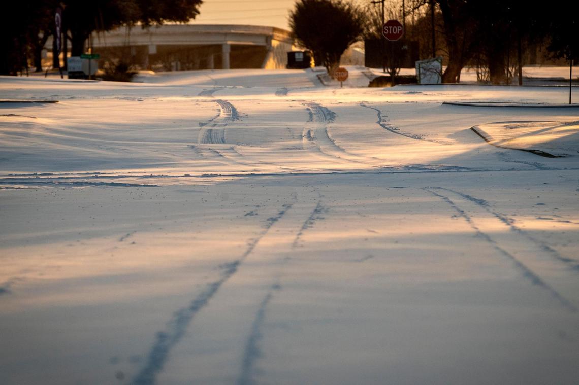 Snow covers the streets after a storm on Feb. 15, 2021, in Fort Worth.