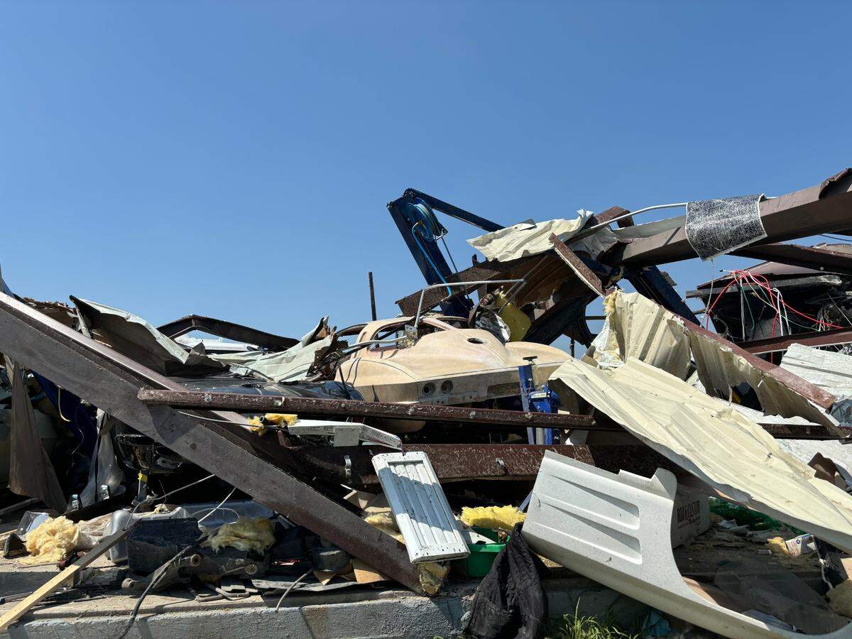 A 1963 Corvette sits among the wreckage at Distinguished Customs, a restoration and modification shop, in Valley View on Sunday, May 26, 2024.
