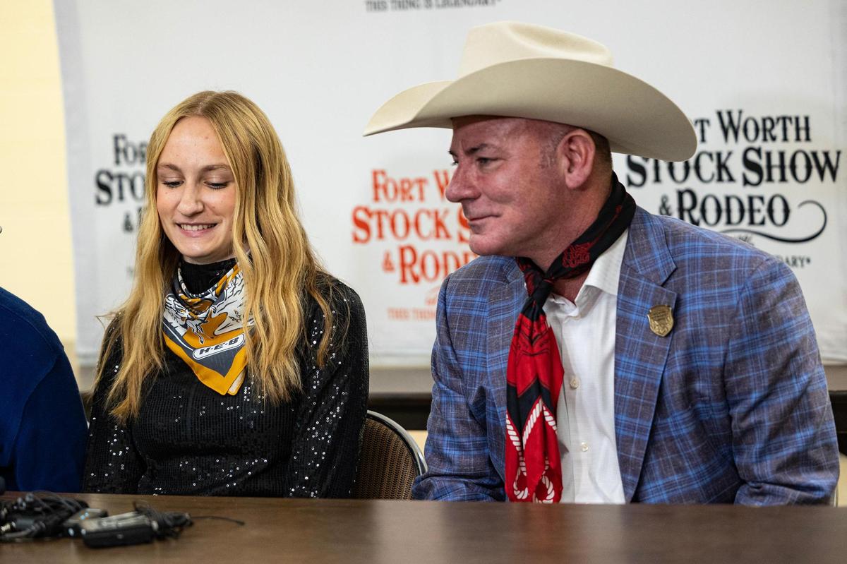 Mattison Koepp, the owner of the grand champion steer, shares a laugh with Shane Vaden, the winner of the grand champion steer auction, during a press conference for the Fort Worth Stock Show & Rodeo at Wyatt Arena on Saturday, Feb. 8, 2025. Koepp’s steer Alley Cat was sold for $375,000.