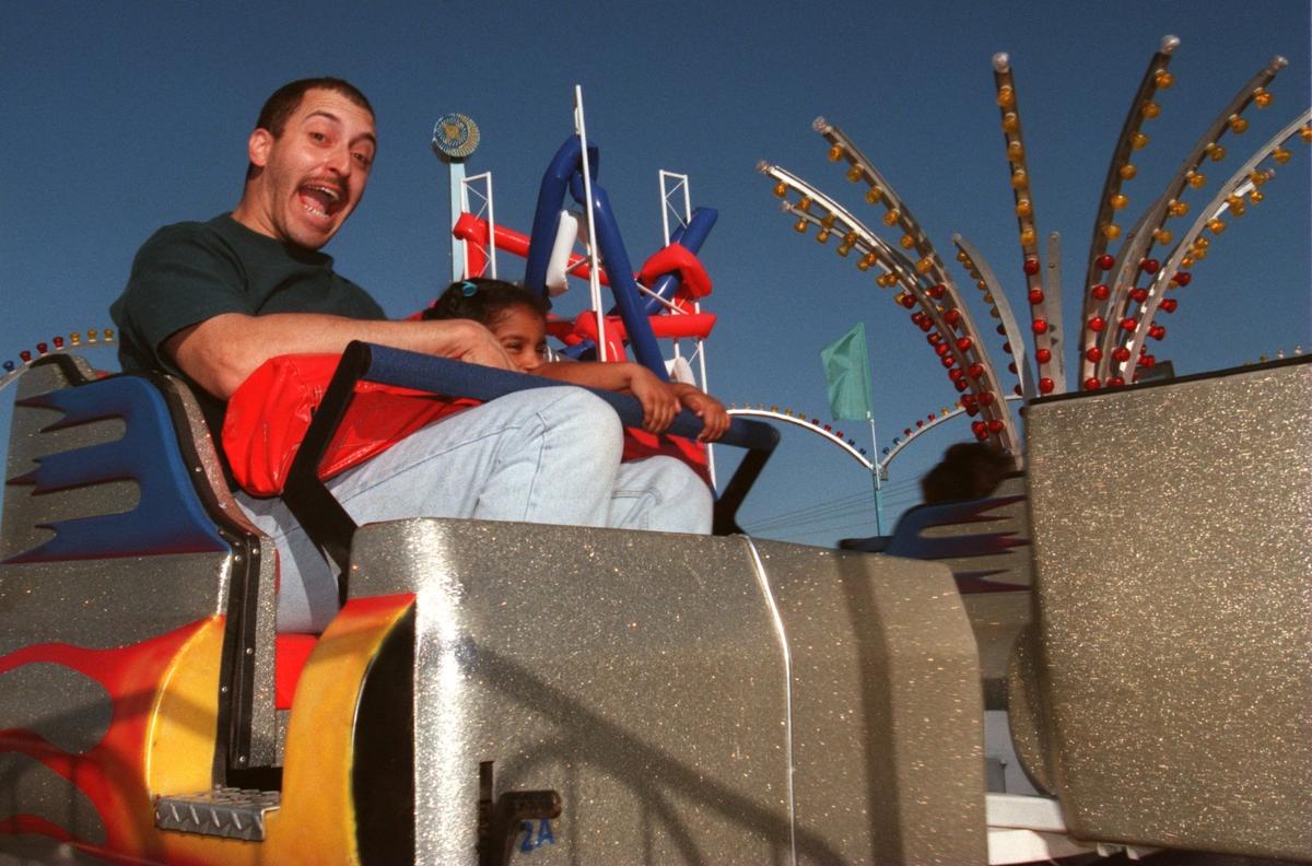 Oct. 19, 1997: Kenneth and Valarie Houston of Garland scream around a turn on the Trizzler at the State Fair of Texas in Dallas.