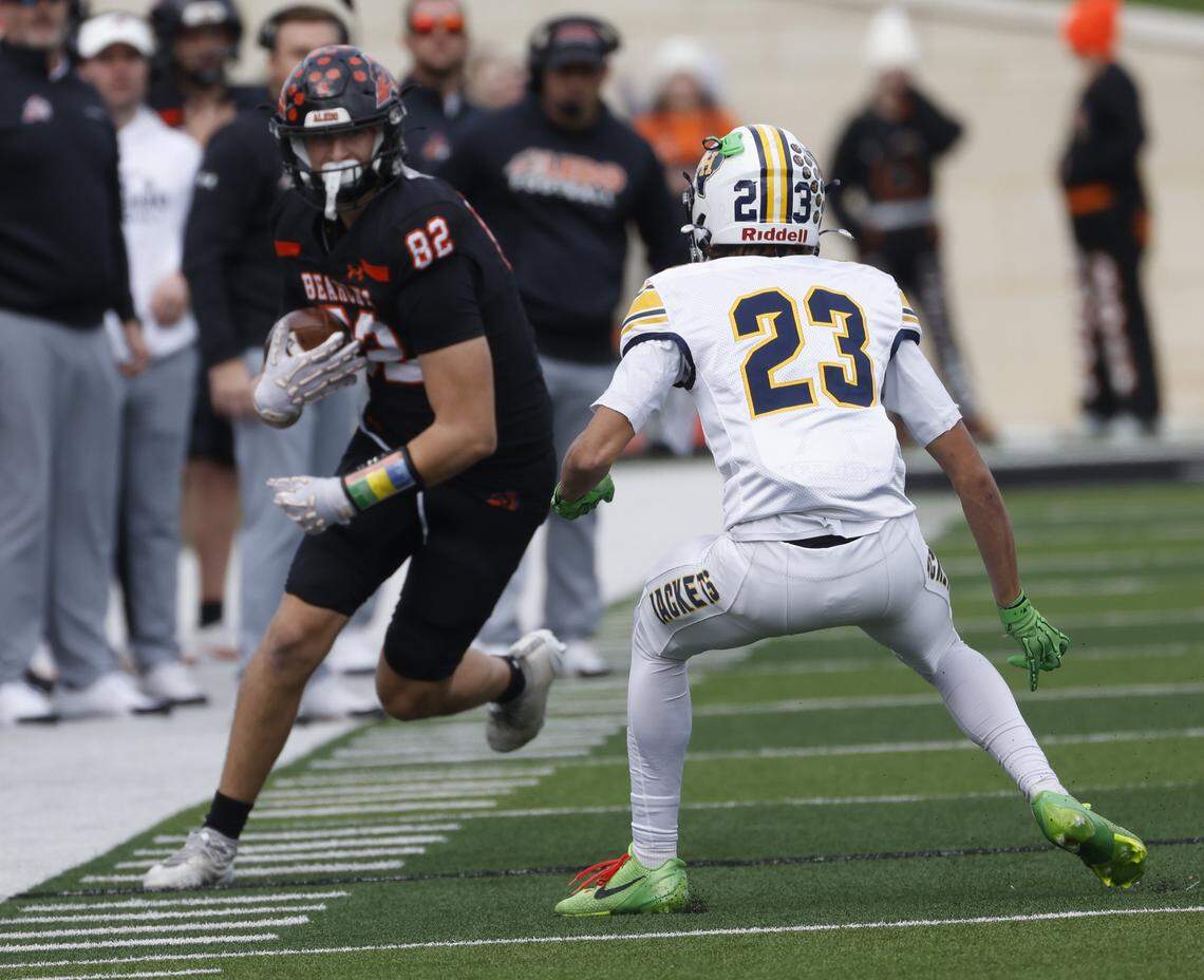 Fort Worth Arlington Heights defensive back Diesel Payne (23) forces Aledo tight end Colby Thompson (82) out of bounds after a catch during the first half of a UIL Class 5A Division I Regional on Friday Nov. 28, 2025 at Crowley ISD Multi-Purpose Stadium in Fort Worth, Texas.
