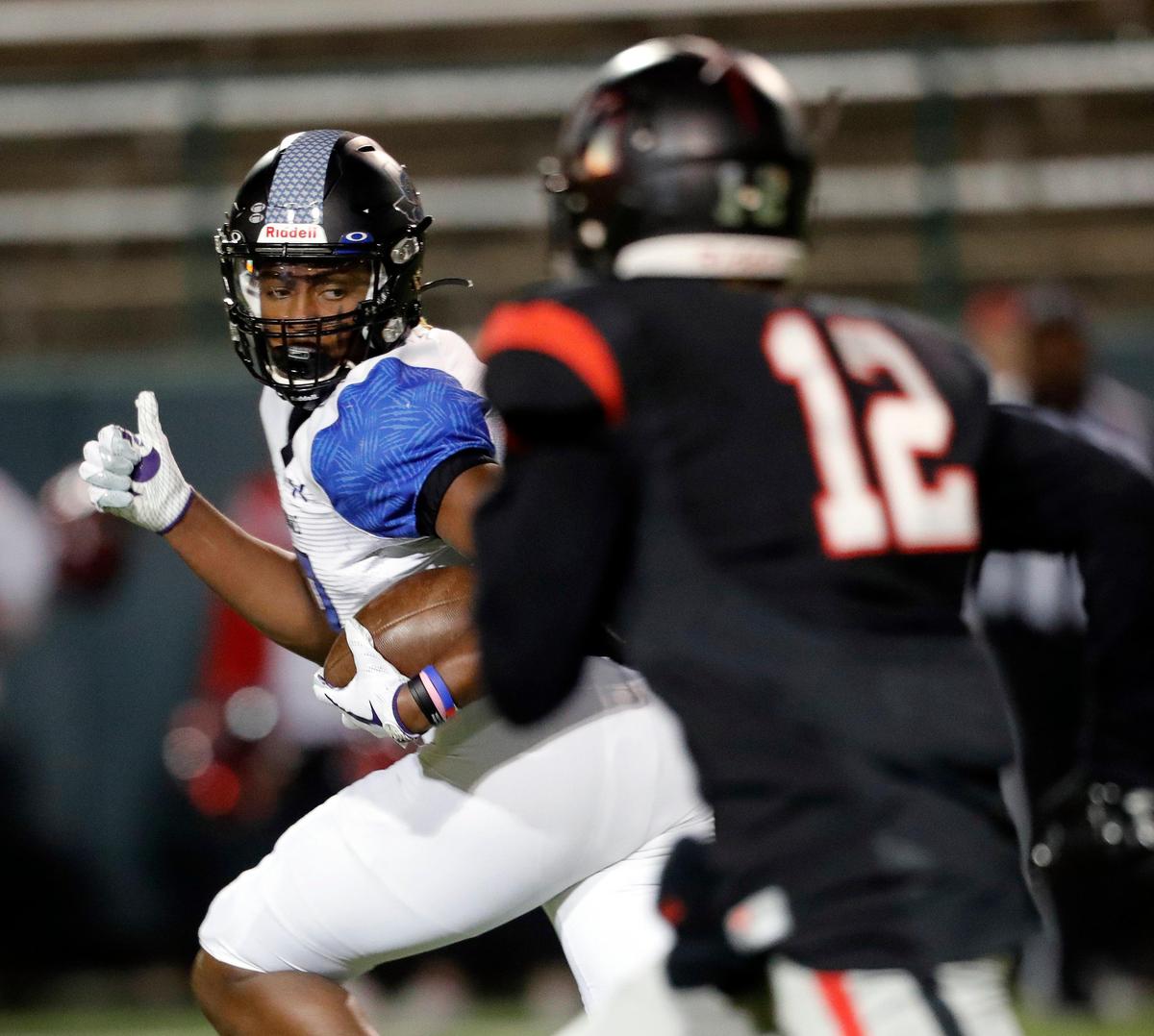 Summit wide receiver Jaelon Travis (3) checks the defenders on his way to the end zone in the first half of a high school bi-district football playoff game at the Gopher-Warrior Bowl in Grand Prairie, Texas, Friday, Nov. 15, 2019. Lake Highlands led 35-19 at the half. (Special to the Star-Telegram Bob Booth)