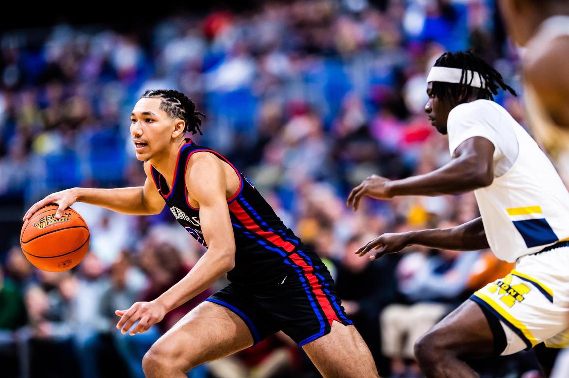 Davion Sykes (22) dribbles the ball out near the three point line in the 6A state final game between Duncanville and McKinney in San Antonio, at the Alamodome, on March 12, 2022. Duncanville won 69-49.
