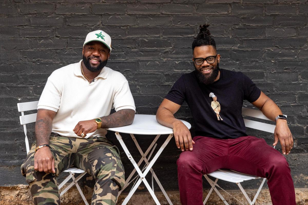 Influencer Jordan Williams poses for a portrait with Scotty Scott, owner and operator of Cheezy Does It, a new food truck at a new truck in Fort Worth on Friday, March 9, 2023. Williams tries and reviews food on social media at @dubbsgrubs and has amassed thousands of followers.