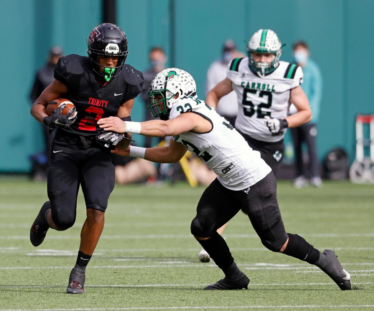 Trinity running back Ollie Gordon (2) carries the ball against Southlake’s Benecio Porras during the 6A division 1 quarterfinals at Globe Life Park in Arlington, Texas, Saturday, Jan. 02, 2021. Southlake led Trinity 38-21 at the half. (Special to the Star-Telegram Bob Booth)