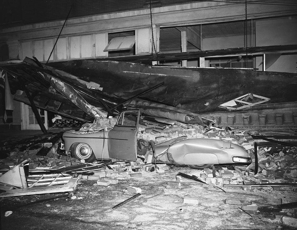 Waco tornado of 1953: “This automobile, found on Austin Street in front of the Montgomery Ward’s store in Waco, was typical of many that were crushed in the murderous tornado. Bodies were recovered from several mashed cars.”