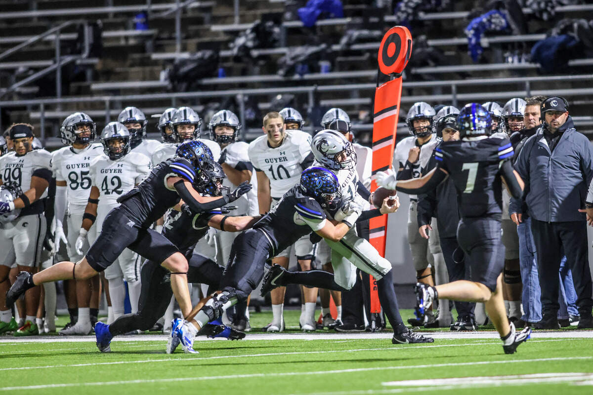 The Byron Nelson defense stops Denton Guyer quarterback Carter Morgan on a fourth down Friday.