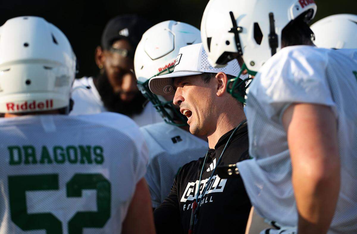 Southlake Carroll football coach Riley Dodge talks to his players during morning practice on Wednesday, Aug. 6, 2025, in Southlake.