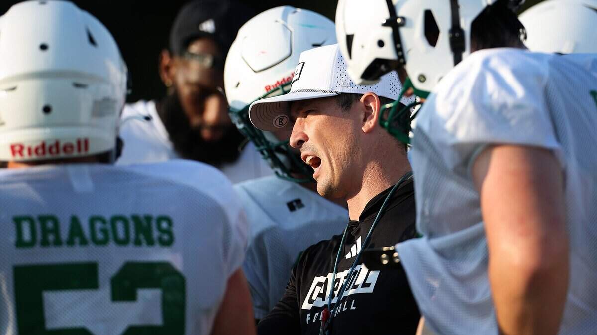 Southlake Carroll football coach Riley Dodge talks to his players during morning practice on Wednesday, Aug. 6, 2025, in Southlake.