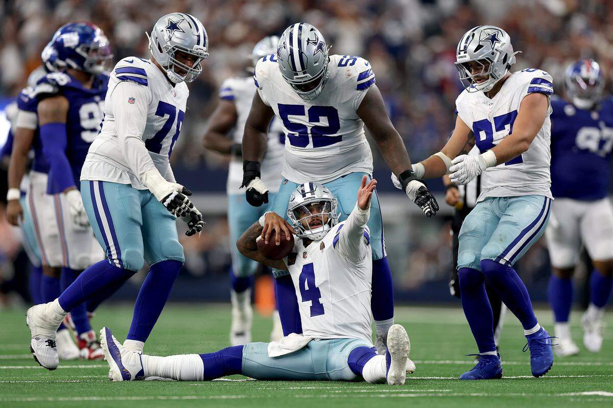 Dallas Cowboys quarterback Dak Prescott celebrates a drive towards the end zone during the fourth quarter against the New York Giants on Sunday, Sept. 14, 2025, at AT&T Stadium in Arlington.
