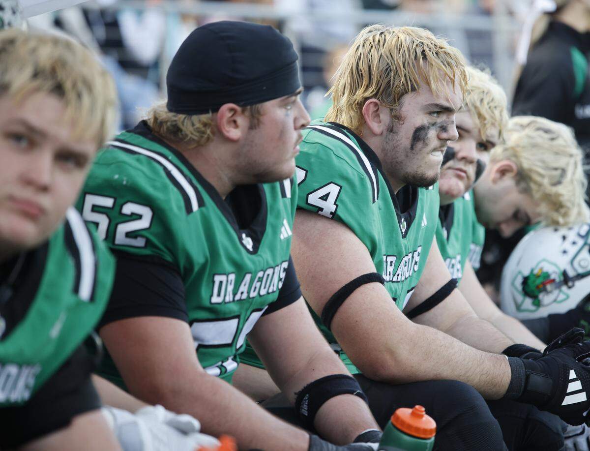 Southlake Carroll offensive lineman Luke Wilson (74) sits with teammates on the bench during the second half of a UIL Class 6A Division II semifinal against DeSoto on Saturday Dec. 13, 2025 at Vernon Newsom Stadium in Mansfield, Texas.