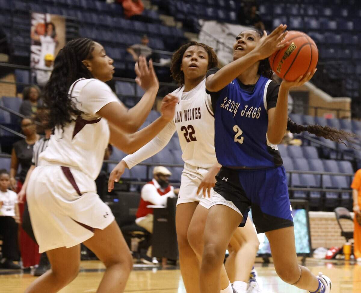 Mansfield Summit guard Aryn Williamson (2) gets a shot off against Mansfield Timberview during the first half of a UIL girls basketball game at Mansfield Timberview High School in Arlington, Texas, Tuesday Feb. 10, 2026.